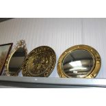 A brass framed circular convex wall mirror, a bras