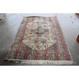 An approx. 7'9" x 5'2" green patterned rug