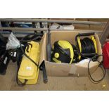 A Karcher pressure washer with various attachments