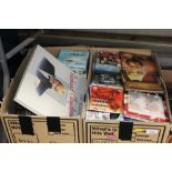 Two boxes of CDs, DVDs and VHS tapes