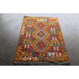 An approx. 4'9" x 3'2" Kelim patterned rug