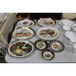 A collection of various plates decorated with phea