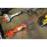 An electric Flymo hedge trimmer