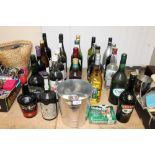 An ice bucket and various alcohol