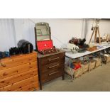 An oak dressing chest fitted three drawers