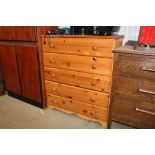 A modern pine chest fitted five drawers