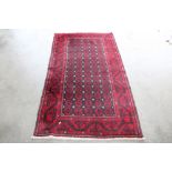 An approx. 6'10" x 3'8" Eastern patterned rug