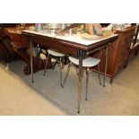 A retro draw leaf table and two chairs