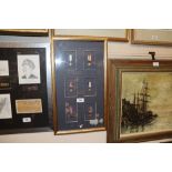 A framed collection of miniature medals