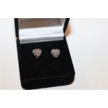 A pair of silver and marcasite set heart shaped ea