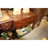 A 19th Century Pembroke table raised on square tap