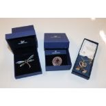 Two boxed Swarovski brooches and a Bradford Exchan