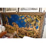 A wall hanging depicting a tiger hunting scene