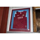 A framed and glazed signed West Ham United shirt,