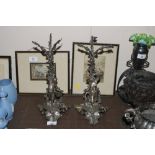 A pair of plated figural decorated stands