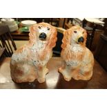 A large pair of Staffordshire dogs