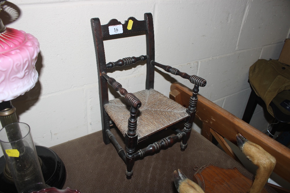 An antique apprentice made child's chair with turn