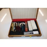 An oak box and contents of various pens to include