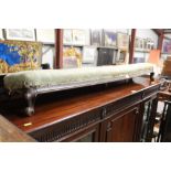 An upholstered footstool approx. 135cm long