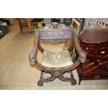 A Victorian Savonarola type chair with makers plaqu