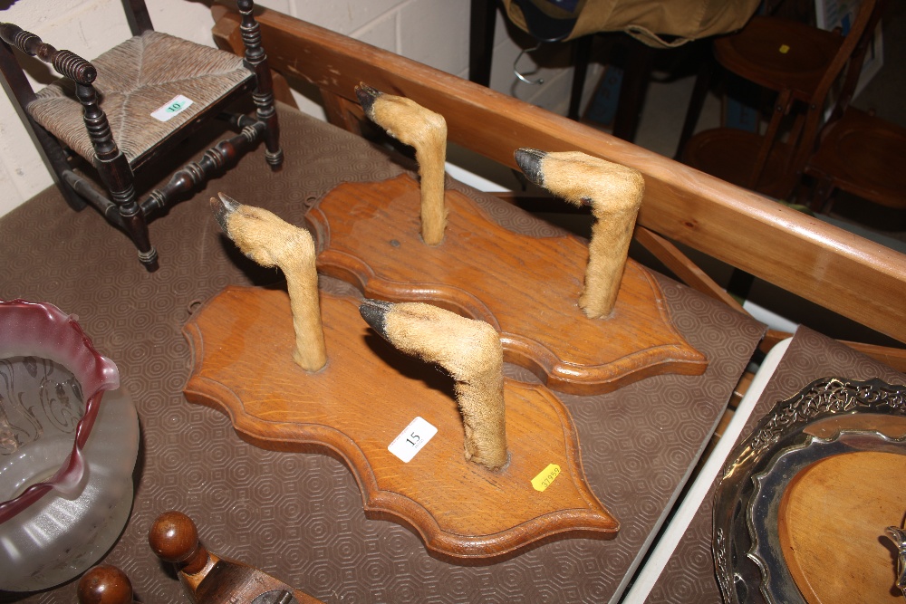 A pair of shot gun racks in the form of mounted de