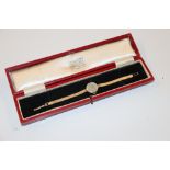 A Garrard 9ct gold lady's wrist watch, total weigh