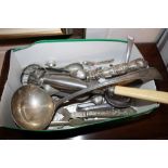 A plated ladle, lobster picks, and various other p