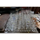 A large collection of various drinking glasses