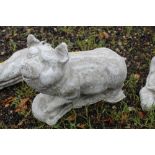 A concrete garden ornament in the form of a pig