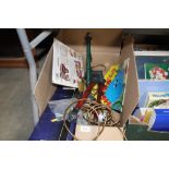 A box containing table lamps etc