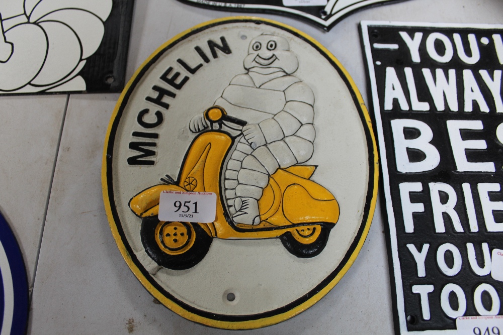 A reproduction Michelin Man plaque