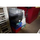A quantity of various plastic storage crates