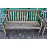 A wooden slatted garden bench