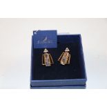 A pair of boxed Swarovski earrings