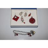 A collection of Sterling silver coral mounted pend