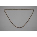 A yellow metal necklace, marked 9K, approx. 73cm,