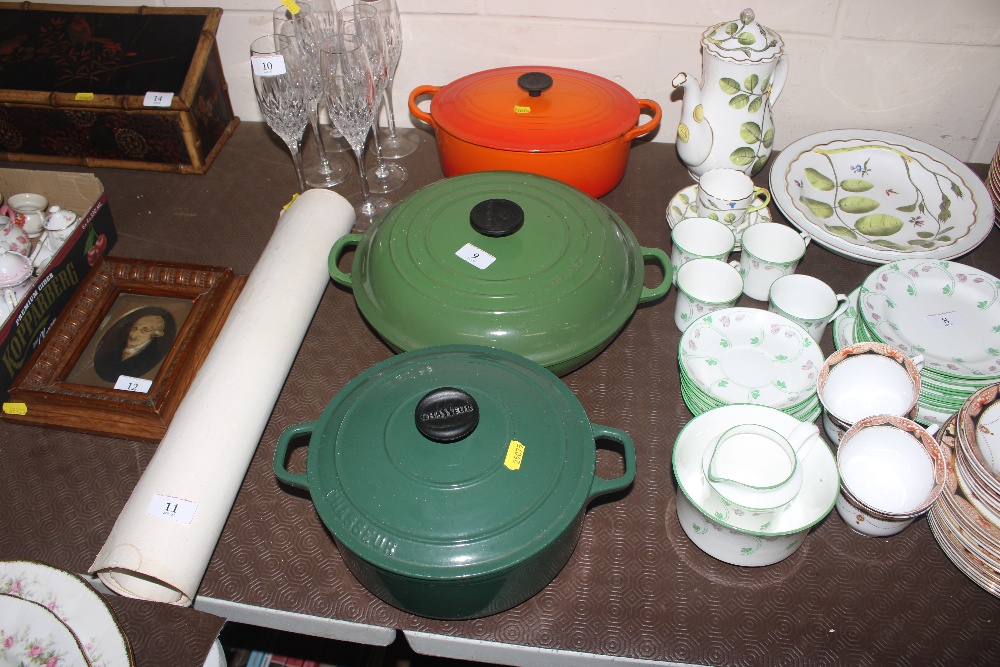 A large Le Creuset pan and cover; a smaller casser