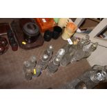 A quantity of various glass cruet bottles
