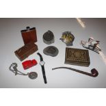 A box containing AA badge, hip flask, fossils etc.