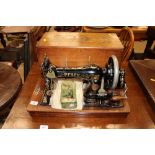 A Pfaff sewing machine in walnut case (case handle