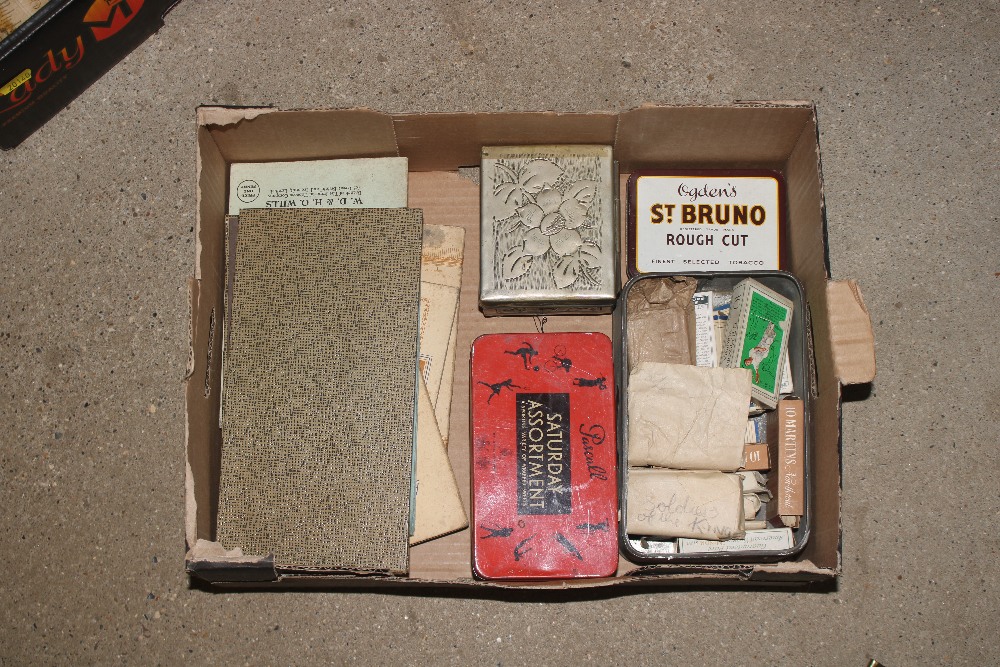 A box containing miscellaneous advertising tins, p