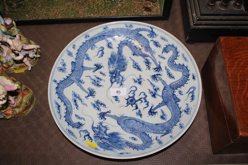 A Chinese dragon decorated blue and white charger,