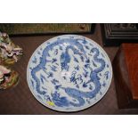 A Chinese dragon decorated blue and white charger,