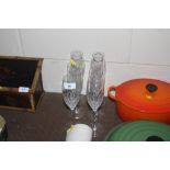 A set of six cut glass wine flutes