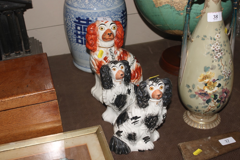 A pair of Victorian black and white Staffordshire