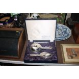 A silver dressing table mirror and brush set