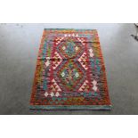 An approx. 4'10" x 2'7" Chobi Kelim rug