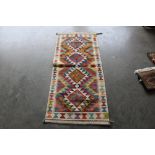 An approx. 4'7" x 2'1" Chobi Kelim runner