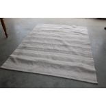 An approx. 7'10" x 5'11" modern rug