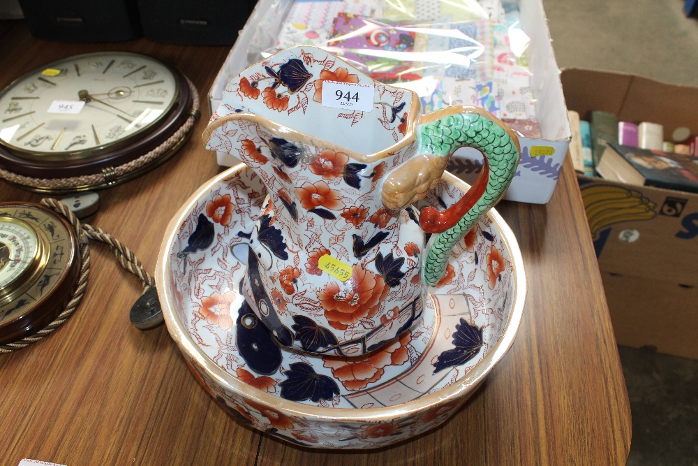 An ironstone wash jug and bowl